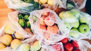 All kinds of fruits and vegetables in plastic bags