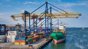 Container ships loading and unloading at the Belfast Harbour container terminal on a sunny evening in June 2021